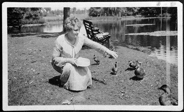 Elsie Stevens feeding ducks in Elizabeth Park. 