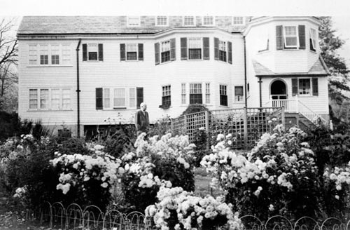 Wallace Stevens behind his Westerly Terrace home. 